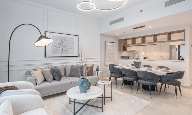 Modern Dubai living room with off-white walls, boucle sofa, and textured neutral decor