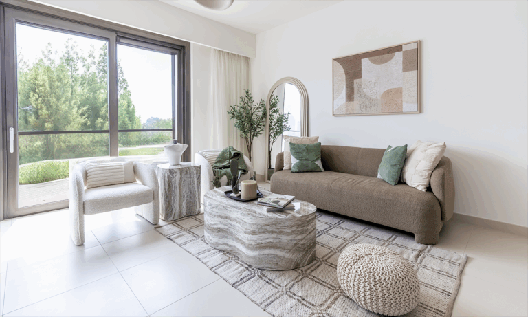 Dubai home interior with terracotta walls, olive green cushions, and natural wood accents