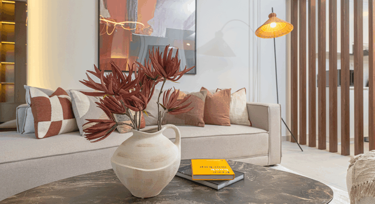 Modern Dubai interior featuring soft minimalist design, warm earthy tones, and sculptural lighting