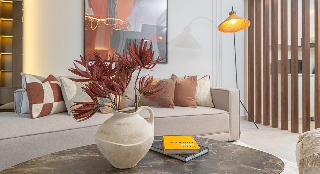 Modern Dubai interior featuring soft minimalist design, warm earthy tones, and sculptural lighting